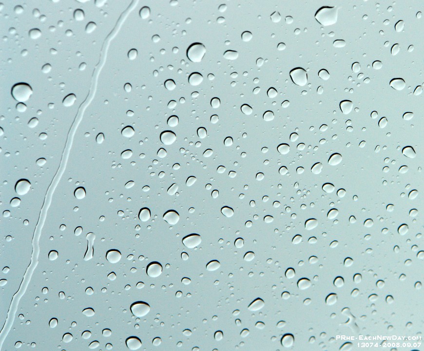 13074CrLeSh - Raindrops on a window on a Sunday afternoon